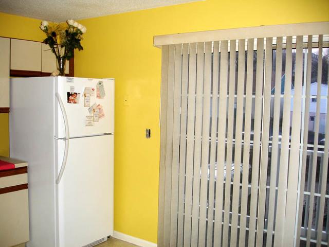 <p>These homeowners were looking to brighten up their kitchen. Scholar applied this bright yellow to the walls of their kitchen to achieve that look!</p>