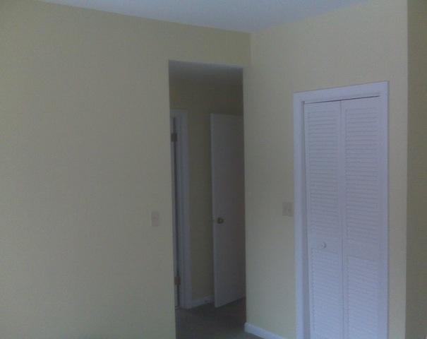 <p>This bedroom was painted a soft yellow. Scholar kept the trim white to again create a nice contrast between molding and the wall color.</p>