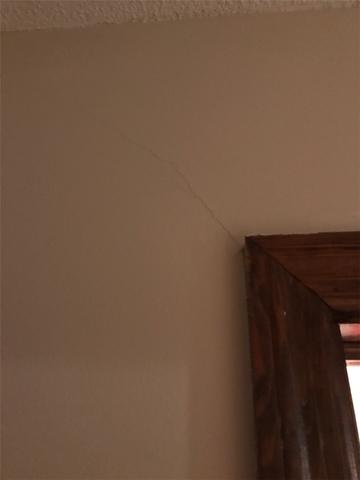 This doorway crack is a sign of settlement of the home.