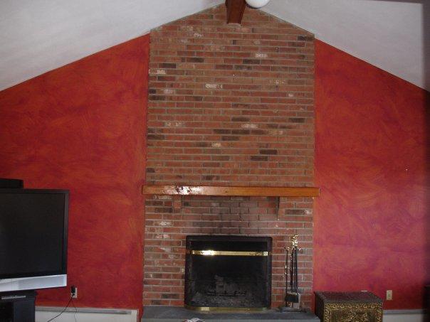 <p>This is showing a painted faux-finished wall surrounding a brick fire place. It really showcases the craftsmanship of the fireplace.</p>