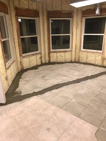 Cement is used to cover the previously exposed WaterGuard system and Lateral Line. Once it is dry, it will not be as obvious that the floor was excavated.