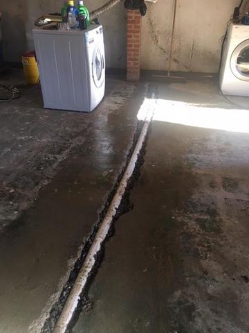 The pipe is connected to the sump pump to ensure that these homeowners will not have a wet basement.