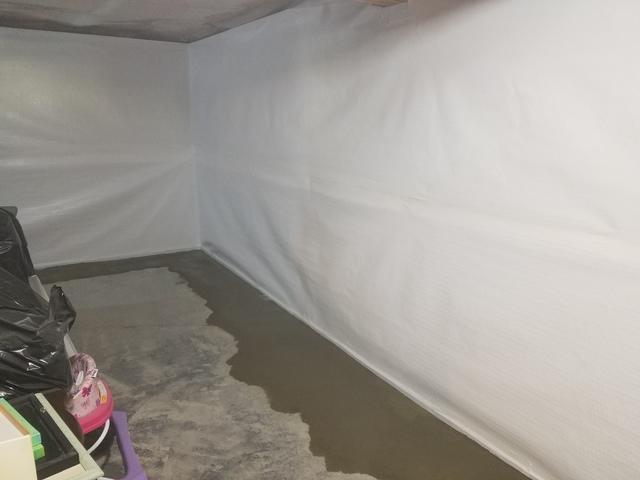 The CleanSpace Wall is a vapor barrier that will protect the basement from wall seepage. It is safe to put walls up over the CleanSpace wall.