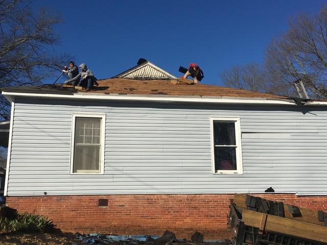 Tear off and replace new roof. Vine St