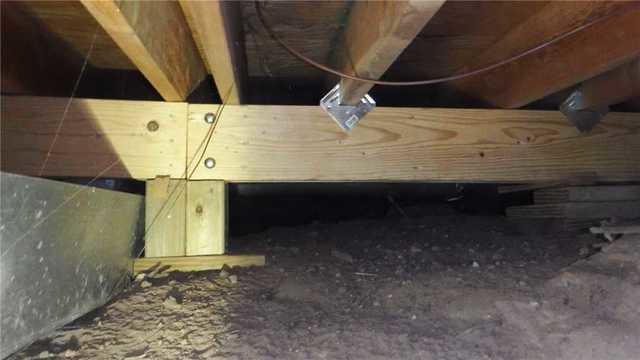 When the homeowners noticed their floors sagging, they had a new crossbeam installed for support, but this wasn't enough.