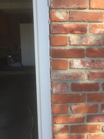 Large Crack Separating the Wall from the Garage Door.
