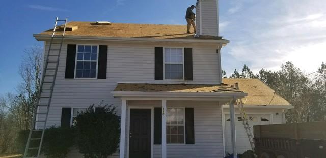 Removing the old roof system.