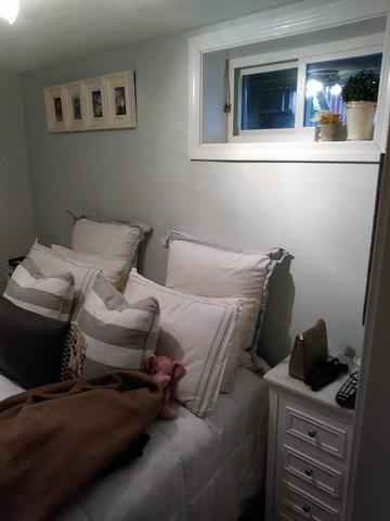 We love the cottage feel to this sweet basement bedroom.