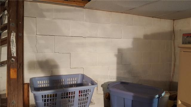 This is the wall before we installed PowerBraces. Stair-step cracking and bowing of the wall at the top are shown here.