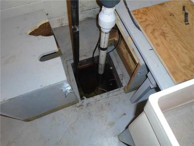 Here is the existing sump pit where our crew installed the new, TripleSafe sump system.