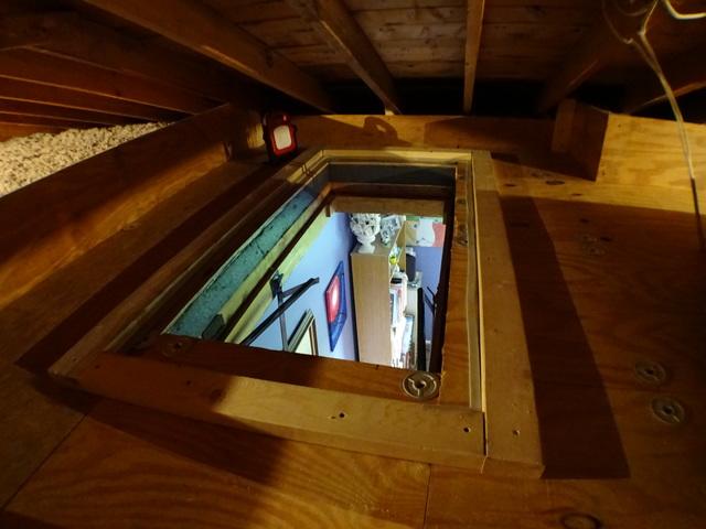 Opening in floor of attic.