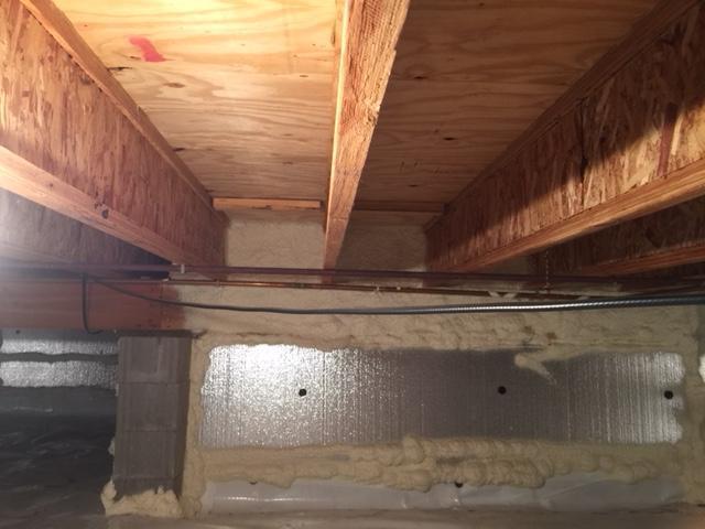 The foaming between the floor joists is to keep the floors warm and to prevent a draft from coming in through the foundation