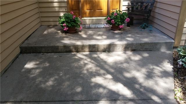 The Burgins concrete slab on their porch has also settled and become uneven.