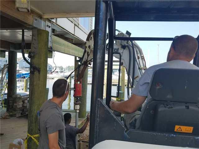 <p>You can see that Todd, Virgil and Derrick are using their years of expertise to ensure that this helical pier is installed to a stable depth.</p>