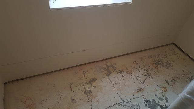 We mark a line around the perimeter of the basement to cut the sheet rock at this point.