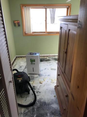 The trim boards are removed from the walls by the homeowner