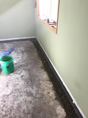 This is the WaterGuard system in the basement bedroom with rocks in the trench ready to be covered