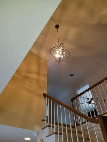 Chandelier above stairs creates focal point