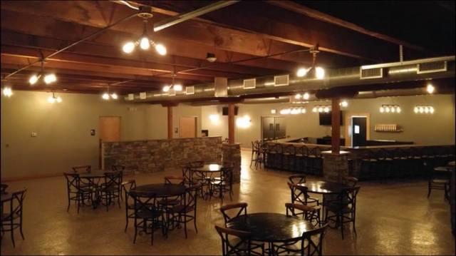 More of the same pipe fixtures highlighting the beautiful woodwork and hard wood floors in the dining area.