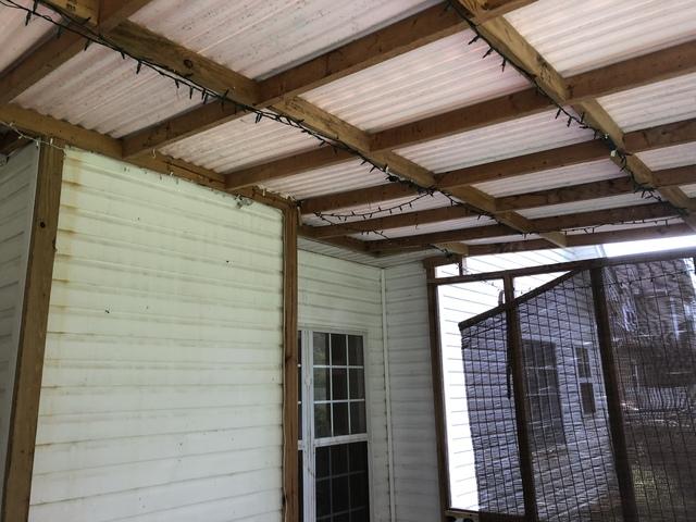 Notice that the old patio roof was nailed directly to the vinyl siding