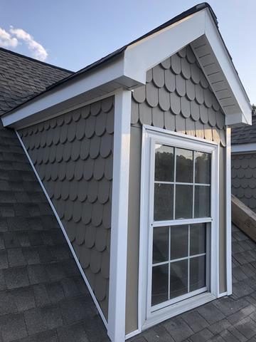 <p>Here is another picture of the new soffit and siding system. Notice the beautiful detail the scallops give to the roof top dormer.</p>