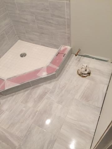 Close-Up View of the Floor, Tile, and Shower