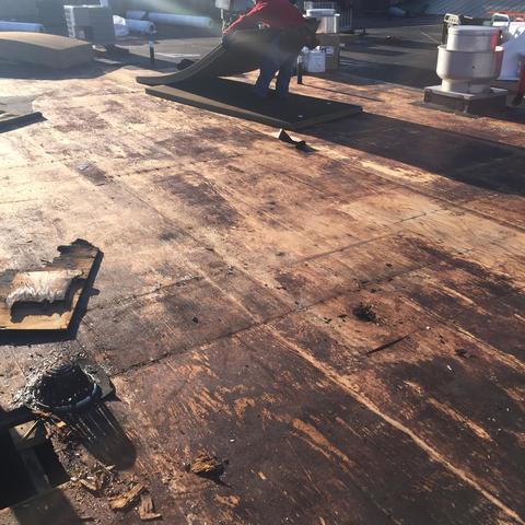 Our team preparing this roof for the commercial roof installation.