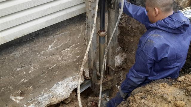 Our team installing Push Piers outside the home.