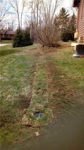 Hiding Discharge Lines Using Lawnscape Outlet