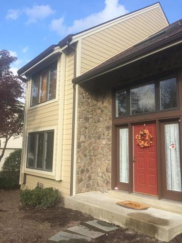 The main goal was to boost curb appeal and the combination of Autumn Tan Hardie Planks and the Old Dominion Stone work so well together to give that elegant look.