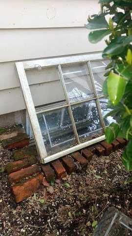 BEFORE: The window wells around the house allowed water to flood the basement.