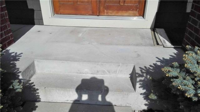 The concrete is now a completely level surface. Jon is glad that his porch is safe again, and that it looks much more aesthetically pleasing.