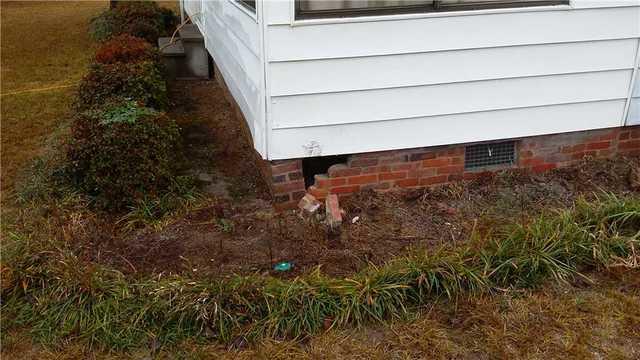 This farmhouse was hit by a car, the foundation was knocked in.