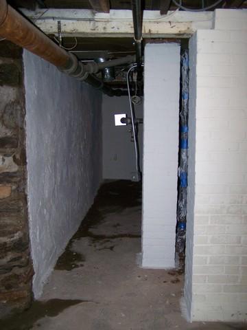 <p>This Southport, CT home has a fieldstone foundation that is allowing moisture to enter the basement, visible in the wet areas on the perimeter. To dry out the basement, we installed our WaterGuard drainage system along the perimeter of the room. Our unique system directs water out of the basement and draws moisture from the walls. The basement of this home is now dry for the owners to enjoy.</p>