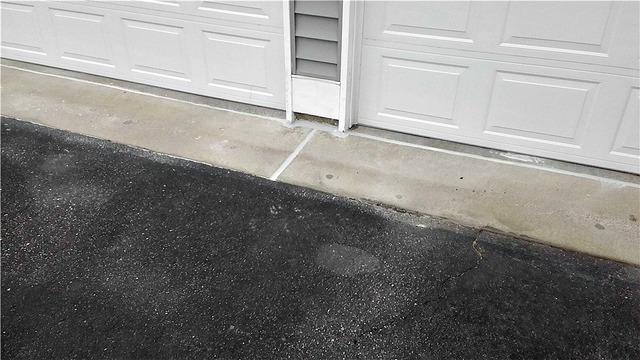 They have finished injecting the foam, which raised the concrete. Then, they sealed the cracks in the concrete with our Nexus Pro sealant, to give the concrete a finished look.