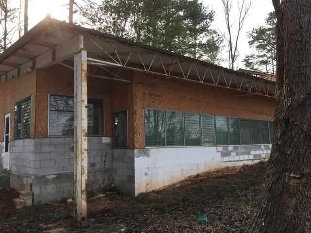 <p>Here is a picture before we installed new fiber cement board and baton siding.</p>