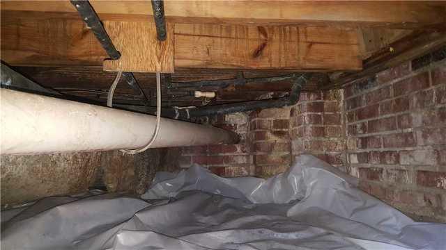 The Lowcountry Basement Systems inspector recommended installing two SmartJacks a PowerBrace in this location to stabilize the house and lift the joist back into place.