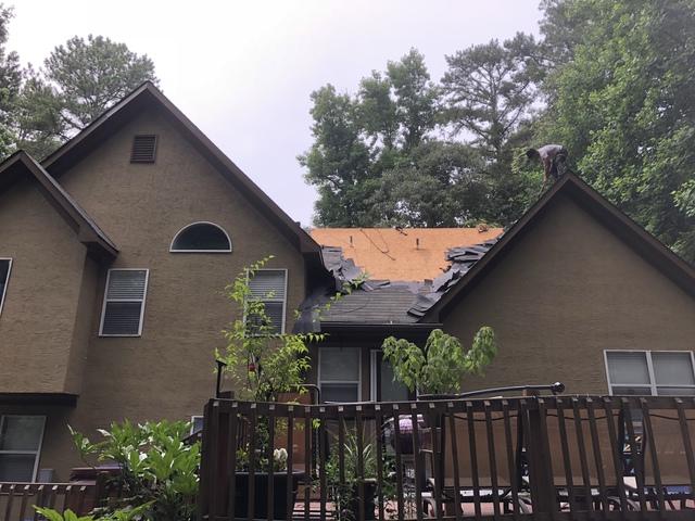 Here we are removing the old three tab shingles and Underlayment