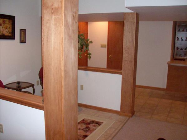 Different angle of the tiled area, additional closet and entrance to the garage.