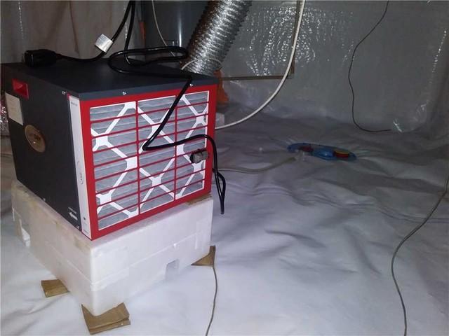 A SaniDry dehumidifier was installed to control the humidity in the crawl space.