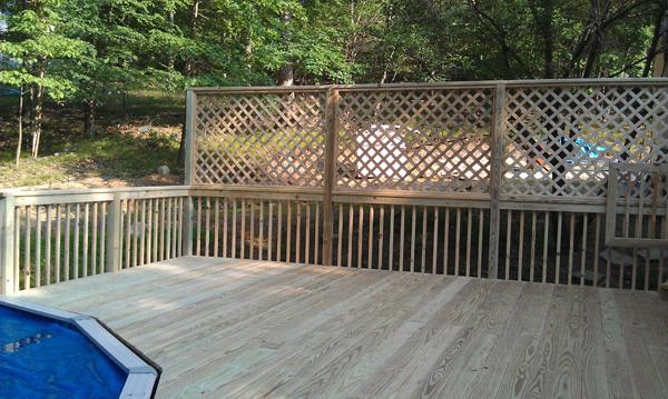 A newly installed deck by a pool for safety and comfort.