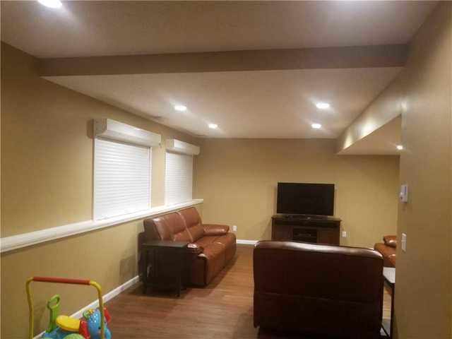 Finishing this basement space allowed for this family to have more space to comfortably watch movies together!