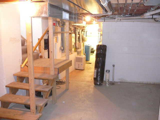 <p>Photo of what the stairs and floor in this Lake Geneva, WI basement looked like prior to our basement finishing makeover!</p>