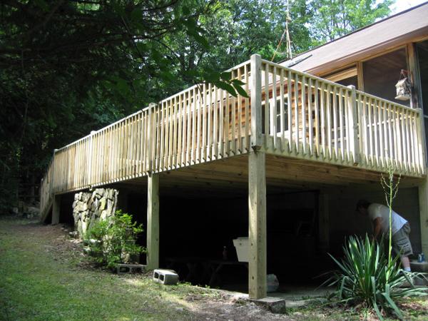 Yard view showing the height and the length of the newly finished deck.