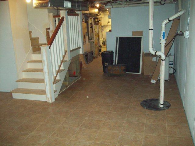 <p>Beautifully finishing stairs and floor in this Lake Geneva basement.&nbsp;</p>