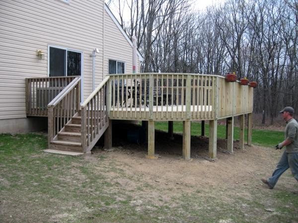 A team member goes to put the final touches on this deck.