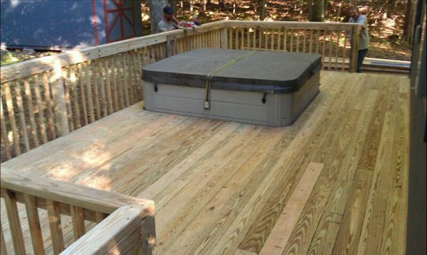 A back view of the deck and the hot tub.