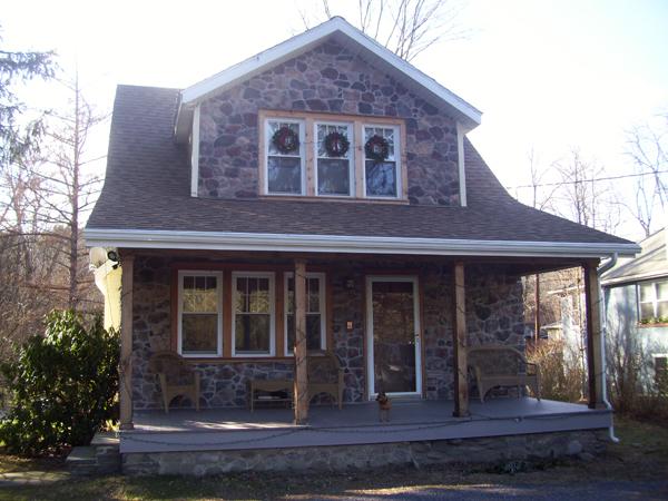 A frontal view of the home where an addition is about to be added.