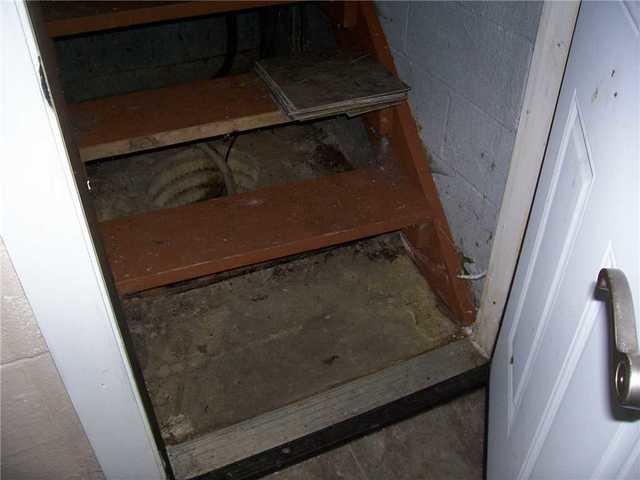 Water Leaking from Under The Stairs