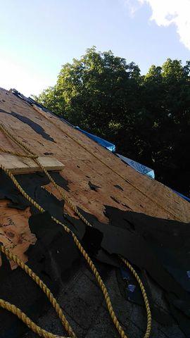 Shingles are removed on a different area of the home. Is your roof sagging or leaking? You may need a roof replacement! Contact us for a free estimate!